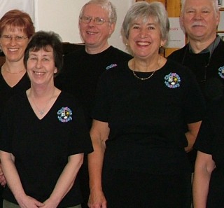 some team members wearing their Christmas Journey T-shirts